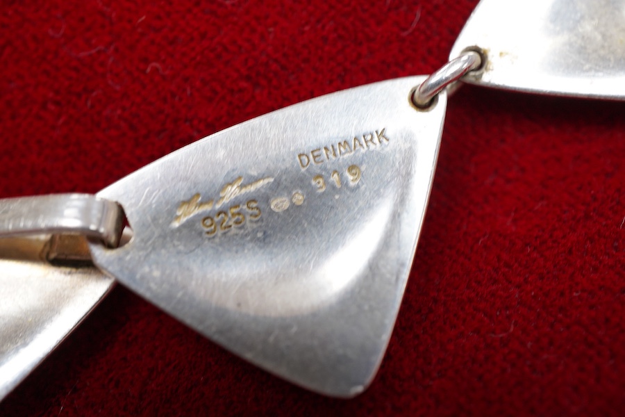 Hans Hansen, a modernist silver necklace, Denmark, composed of triangular linking in silver, to a concealed hook clasp, length 37.5cm, signed Hans Hansen, numbered 319, stamped Denmark, Swedish assay marks, gross weight